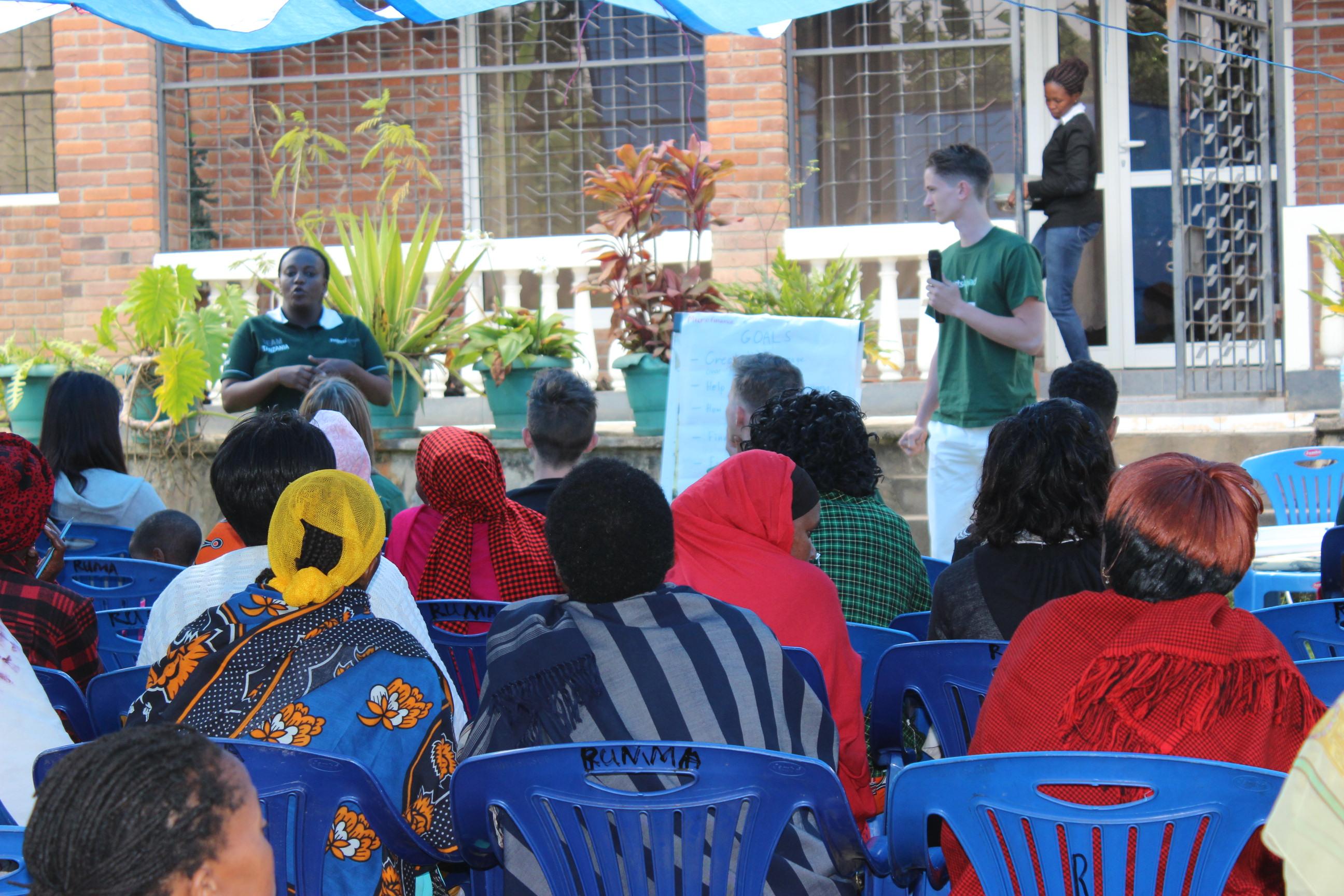 Projects Abroad interns speak to a group of women about running businesses during their Micro-finance internship in Tanzania. Interns give a presentation to a group of women business owners and gain micro-finance work experience in Tanzania.